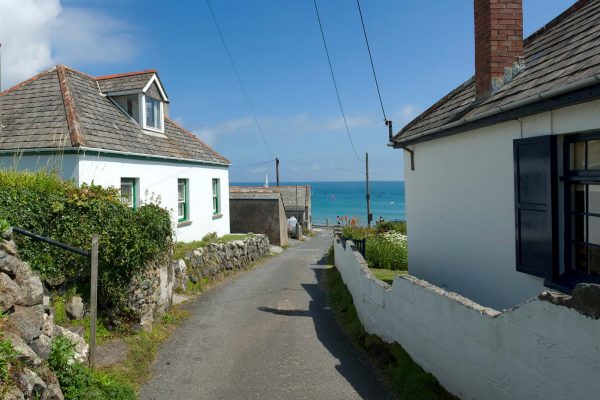 holiday home rental example - white cottage with coastal view