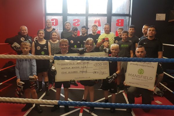 Mansfield All Star Amateur Boxing Club children holding cheque