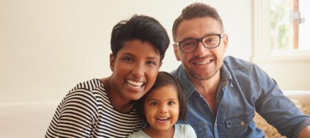 Man woman and young girl smiling